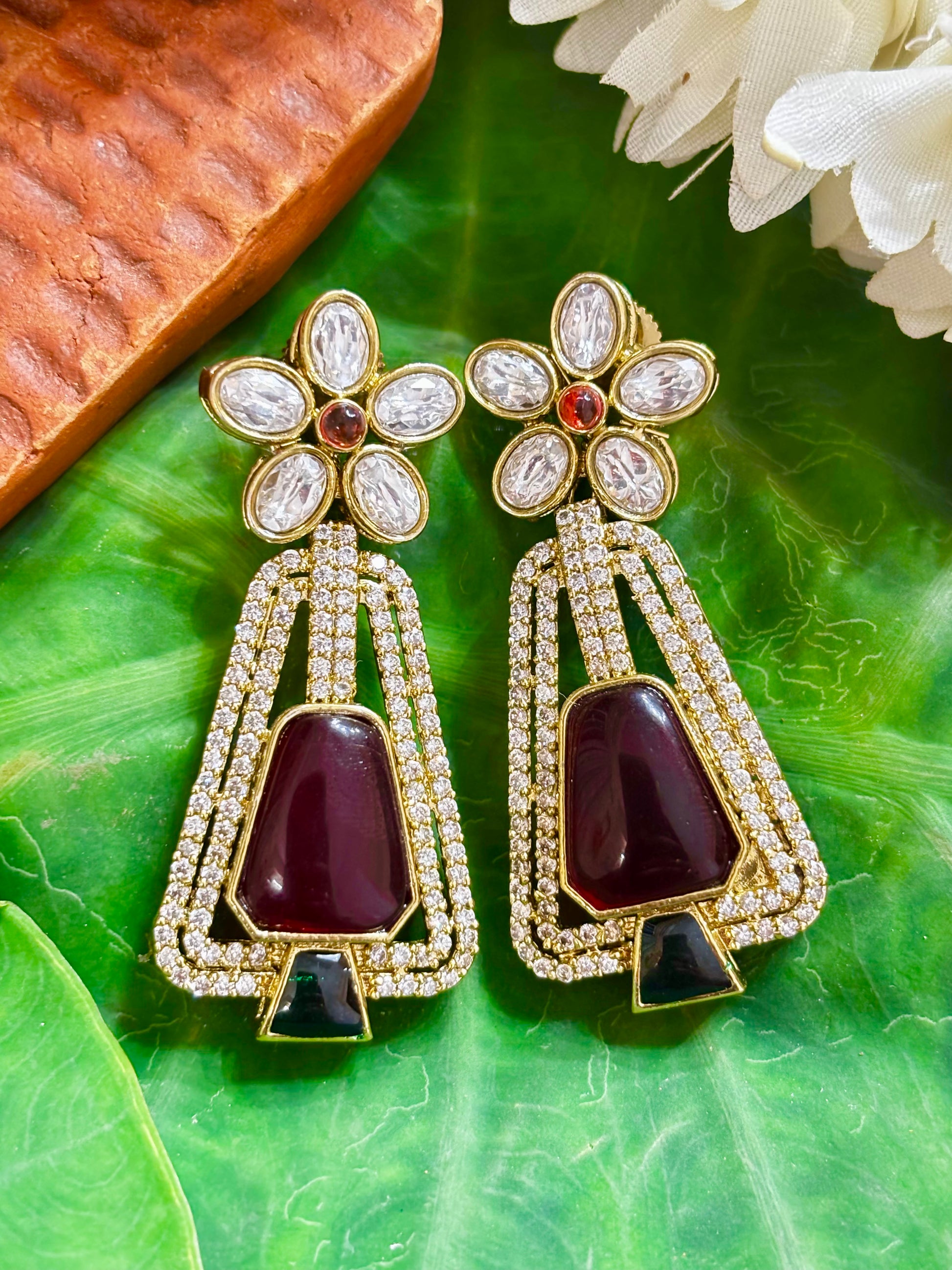Maya Gold Art-Deco Trapezoid Statement Earrings with Maroon Center Stone, Green Base Accent, and Floral Kundan Stud
