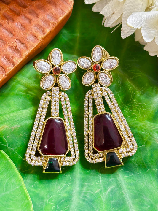 Maya Gold Art-Deco Trapezoid Statement Earrings with Maroon Center Stone, Green Base Accent, and Floral Kundan Stud