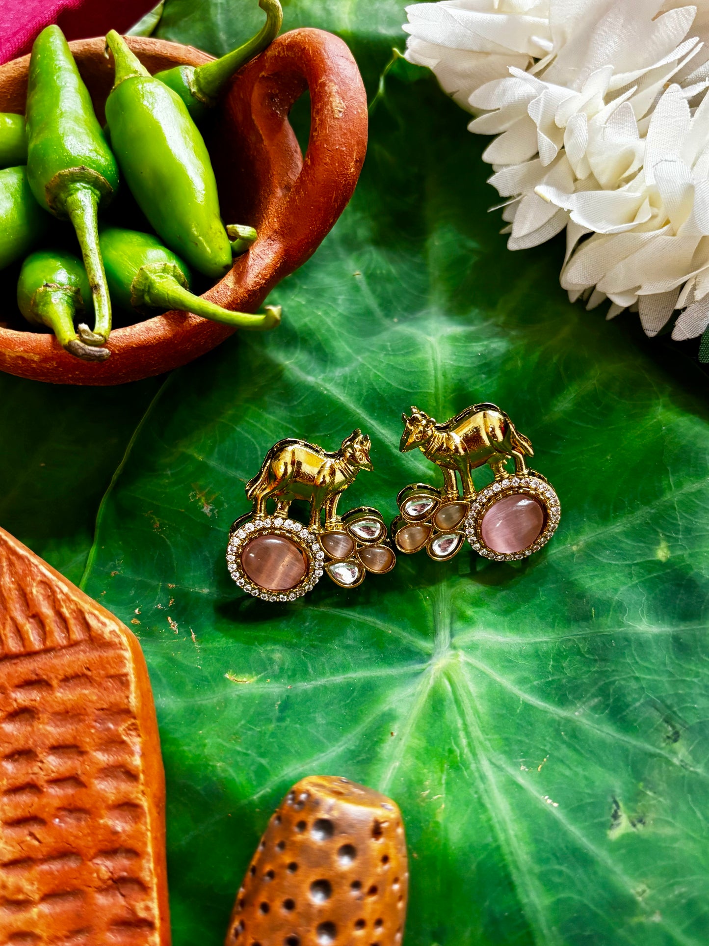 Maya Gold Sculpted Camel Motif Stud Earrings with Pink Cat-Eye Stone Frame and Kundan Accent